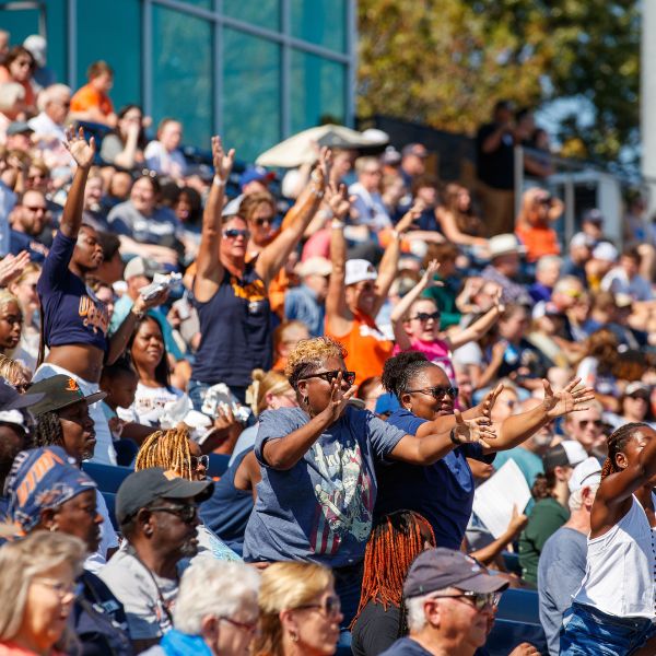 utm-homecoming-25-crowd-600x600-2507 Crowd cheering at a football game.