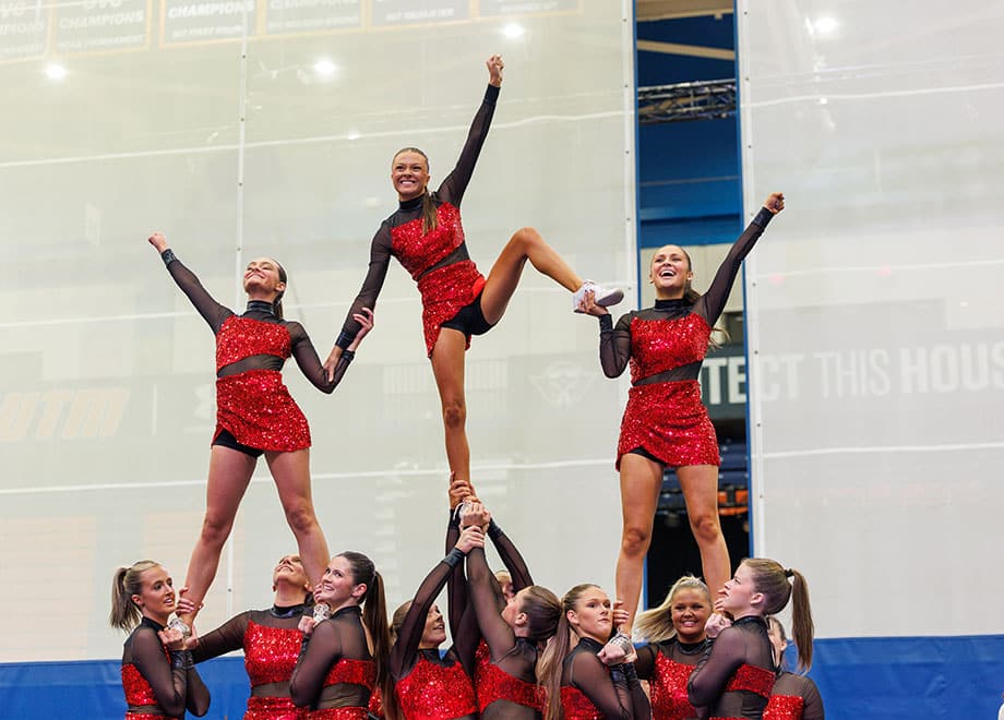 Cheerleaders form a pyramid.