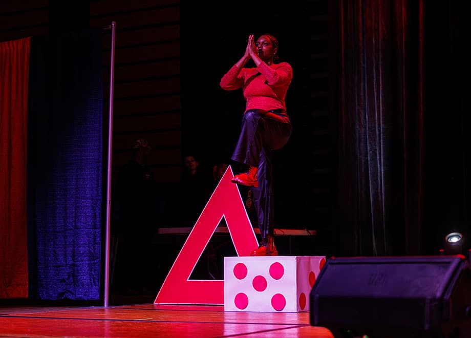 An adult performs during a step show.