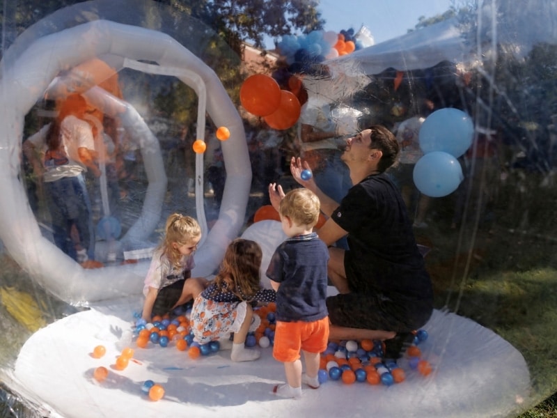 A family enjoys homecoming celebration activities.